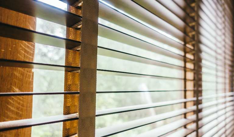 Clean Faux Wood Blinds on window.
