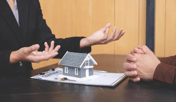 Midsection of couple holding hands on table