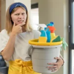 Woman thinking with mouth and eyes wide open and hand on chin